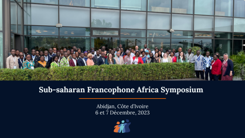 conference attendees standing in front of location