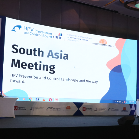 stage for symposium - background says south asia meeting