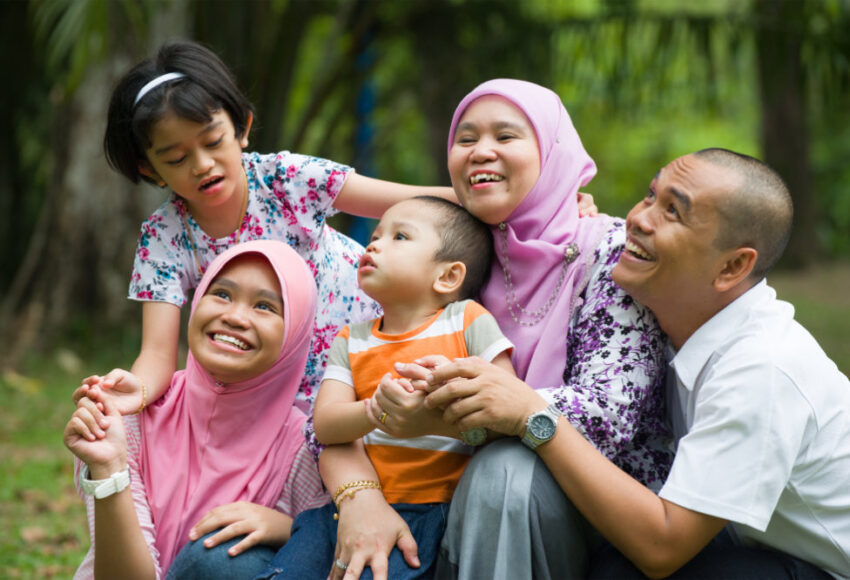 lifestyle photo of malay family having fun in the park ,malaysian people